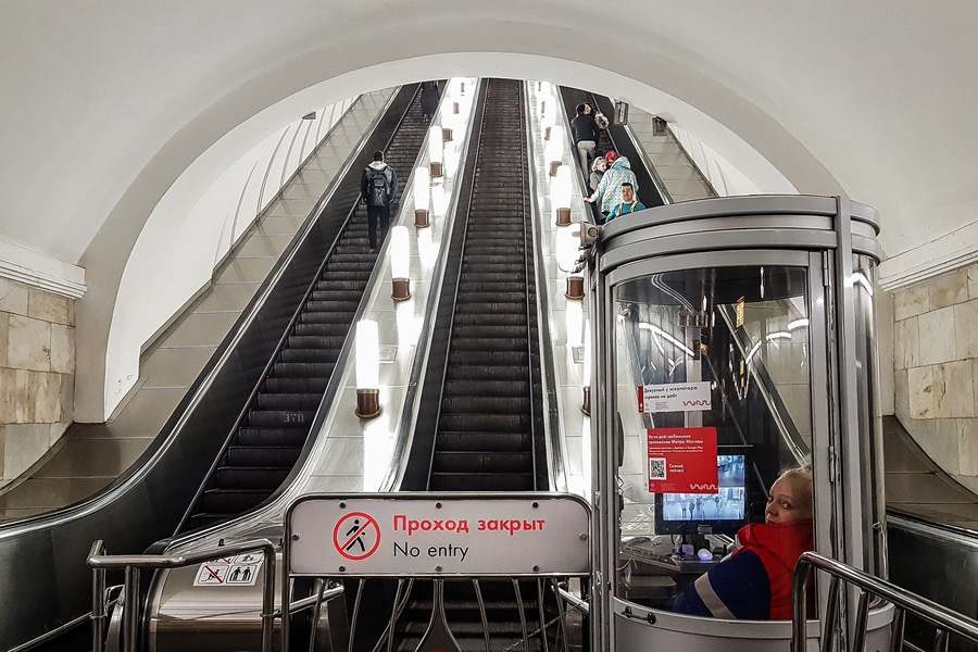 Control at the escalator in the Metro of Moscow