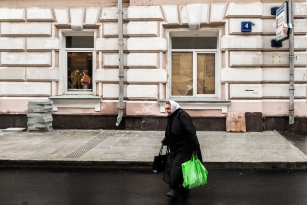Woman with purchases in the Old Town of Moscow