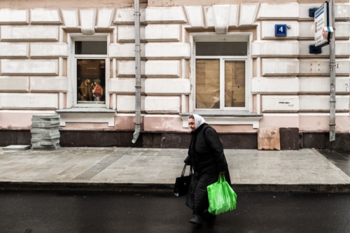Woman with purchases in the Old Town of Moscow Woman with purchases in the Old Town of Moscow