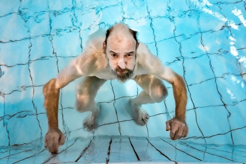 Norbert practises the art of breathing under water Social documentary photography from the project Breaks and new beginnings